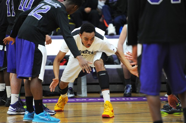 Pioneer High School's Tevis Robinson makes his way onto the floor during introductions at Pioneer on Tuesday, Feb. 19, 2013. Melanie Maxwell I AnnArbor.com